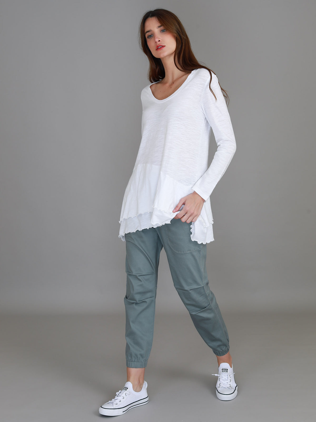 white ruffle hem long sleeve top