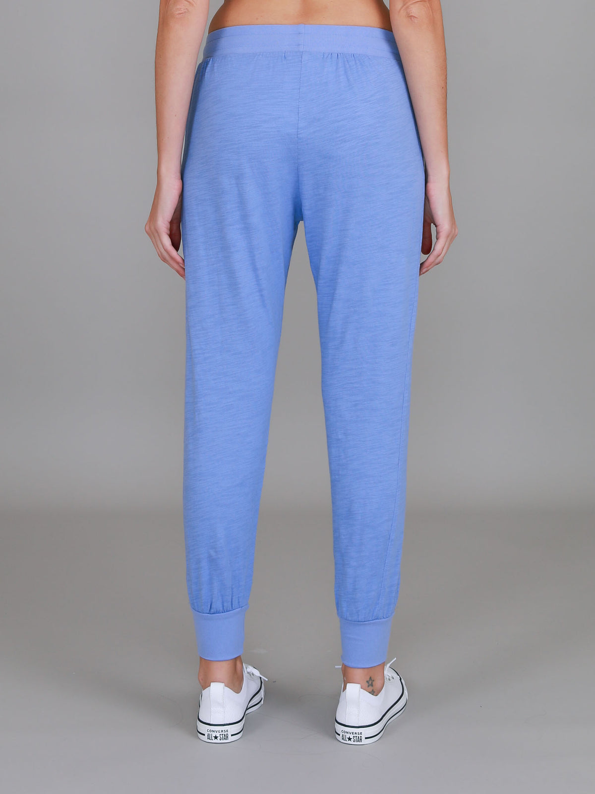 purple joggers outfit