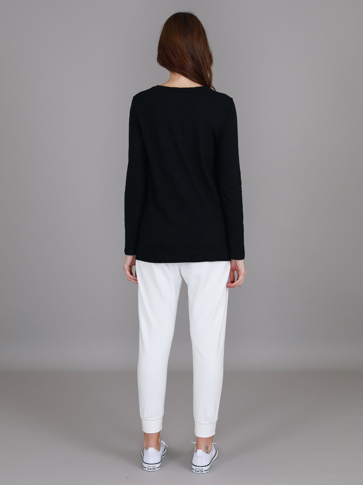 black curved hem long sleeve top