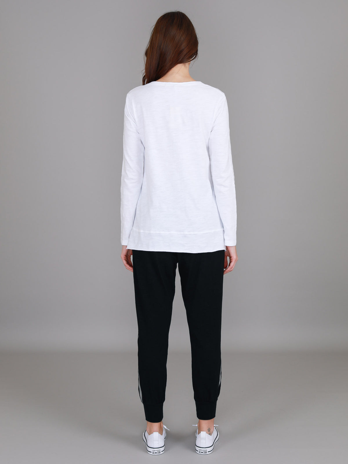 white curved hem long sleeve top