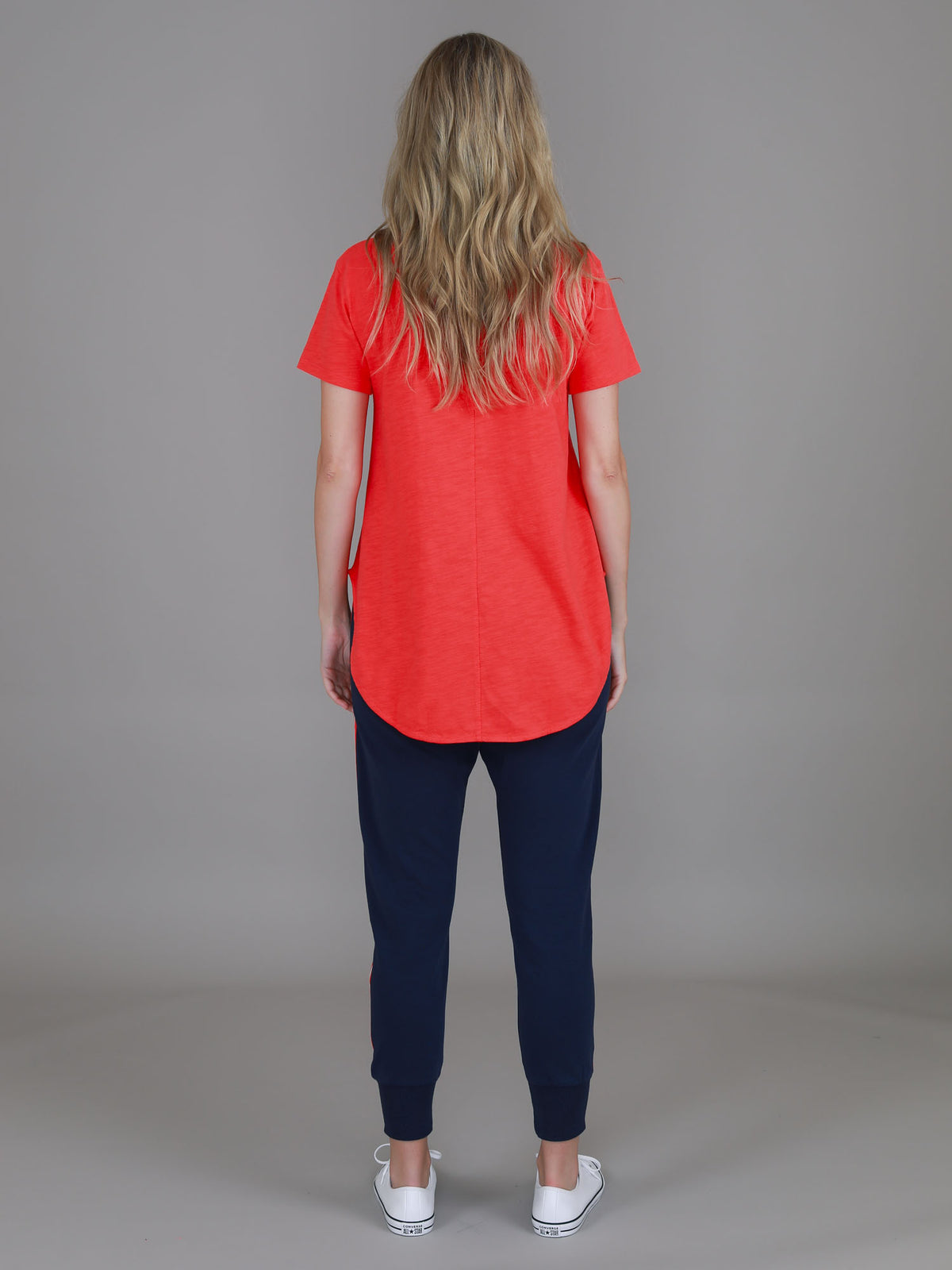 red curved hem tee